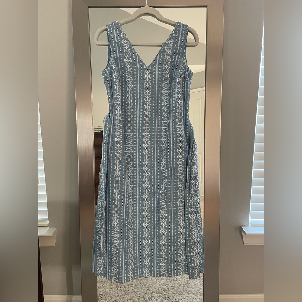 Pastel blue dress with white eyelet pattern. Worn only twice, new condition.